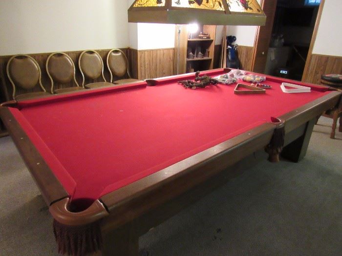 a friendly billiards competition might spring up at any moment....on this beautiful Brunswick, priced to sell. Also for sale, the light fixture above.