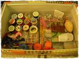 Sewing  box full of sewing notions.