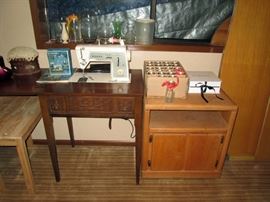 Basement:  TV stand, Singer sewing machine, Box of small bottles, White box