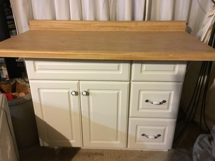 -Cabinet and top are not attached; cabinet measures 30 1/2" tall, 36" long, and 22" deep; top measures 4" tall, 48 1/2" long, and 25" deep