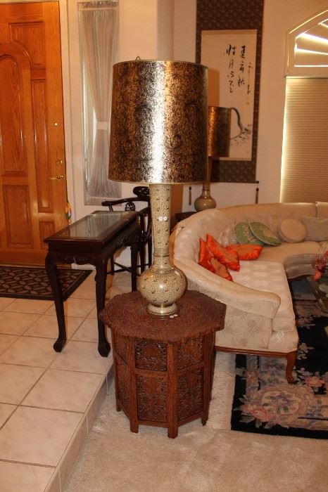 Rosewood end tables and tall, ornate lamps