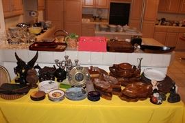 An abundance of carved-wood kitchen and dining wares