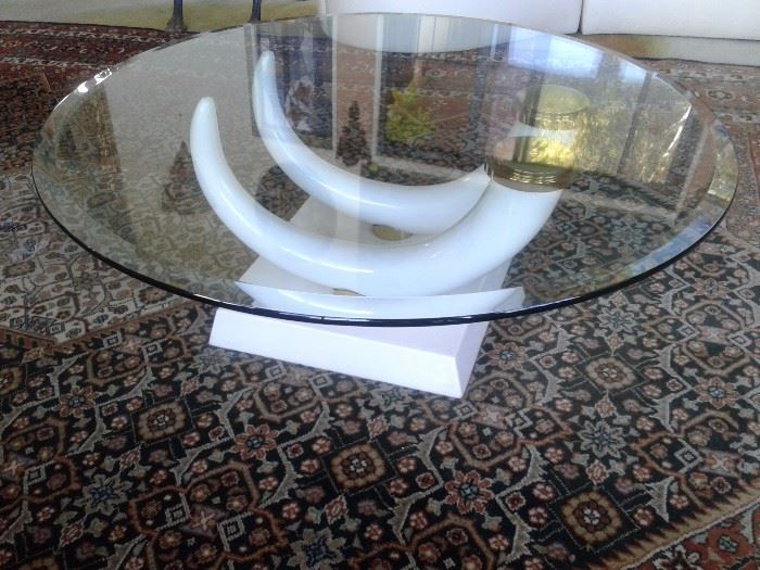 Elephant Tusk Round coffee table, glass top  resin base 