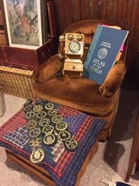 Brown swivel chair with ottoman, vintage horse parade harness with brass medallions