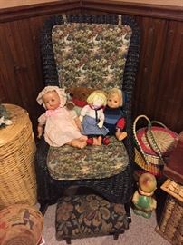 Green wicker chair, vintage dolls