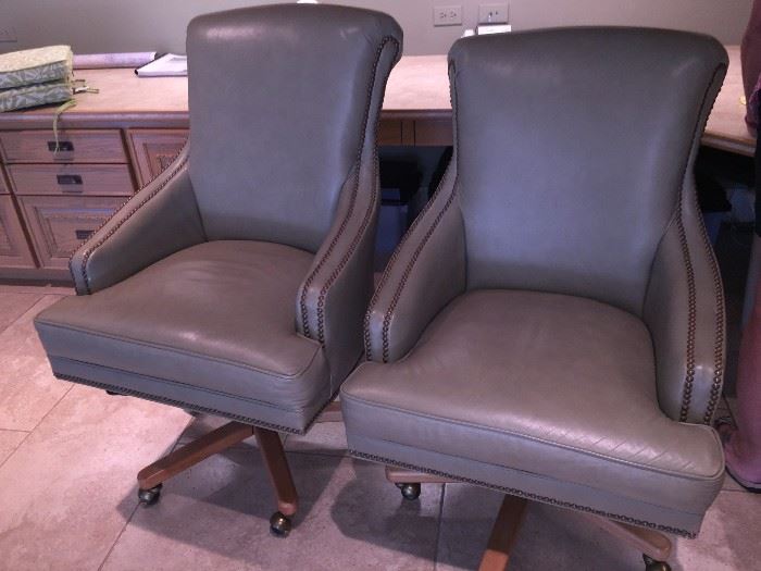 two solid leather rolling barrister desk chairs