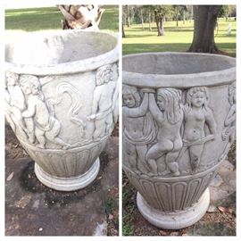 pair of very large matching concrete urns