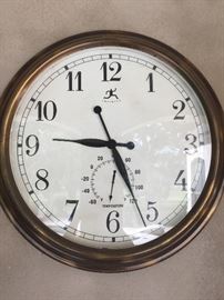 one of two very large wall clocks