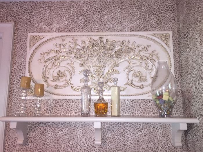 decorative wall hanging and many crystal decanters