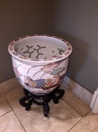 one of several painted Asian fish bowls on stands
