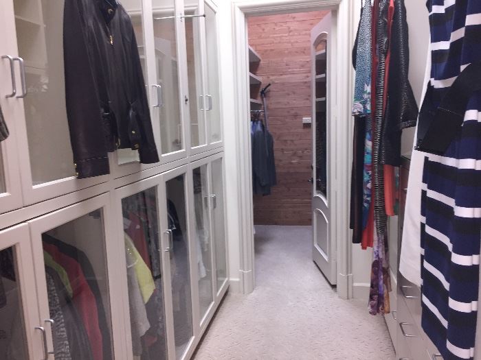Two room size closets filled with designer women's clothing size 4--10