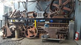 Metal art work some anvils and a post vice