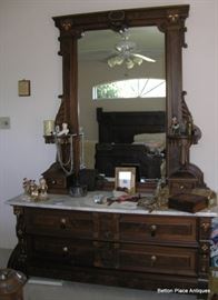 Victorian Renaissance Large Dresser with Mirror, marble top, Two Drawers, such unique Carving on sides of mirror above Glove Boxes. Please check details in other photos provided. 84 1/2 inches tall, 61 1/2 inches wide, 22 1/2 inches deep.