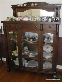 Empire Oak Display Case, 44 inches wide, 20 1/2 inches deep, 61 inches tall.