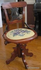 Piano Stool, swivels , with metal lyre style inset.