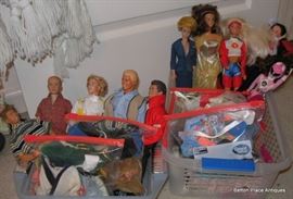 Vintage Barbie and Ken dolls with clothes and accessories