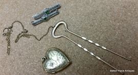 Heart locket is 10 kt gold, Hatpin is 10 kt gold