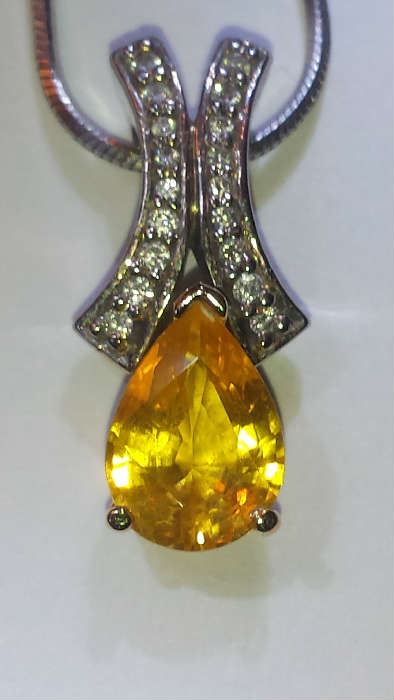 2.58ct yellow sapphire pendant with 18 diamonds - by appointment only