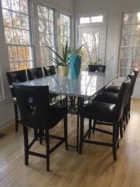 Custom made Woodbury Forge iron base table with granite top. Pier 1 chairs.