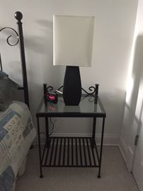 Glass top and metal bedside table.