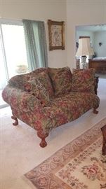 Ashley Furniture Loveseat. Claw Foot Wood Legs. Matching Couch & Recliner Chair Available.  Great Condition 73"w x 40" Tall x 28" Deep. Arms are 29" from floor