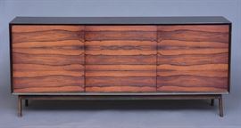 Danish Modern Rosewood Credenza	
with ebonized top
72" x 19", 31 3/4" high
mid-20th century    Bid on-line November 10th -15th at www.fairfieldauction.com