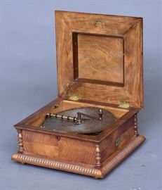 Kalliope "Bell" Music Box	
18 1/2" wide x 9 1/2" high x 18" deep
playing 13 3/8" disks, with 30 disks
circa 1900    Bid on-line November 10th -15th at www.fairfieldauction.com