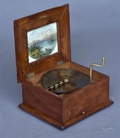Polyphon Disk Music Box
inlaid lid, playing 11" disks with 18 disks
16" wide x 8" high x 14" deep
circa 1900    Bid on-line November 10th -15th at www.fairfieldauction.com