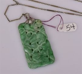 Chinese Carved Jade 14k Gold Pendant	
with diamond accents, 2 1/2" long
on an 18k gold chain, 28" long 
together with a 14k gold carved jade
Bid on-line November 10th -15th at www.fairfieldauction.com 