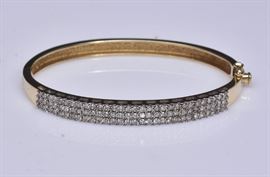 14k Gold Diamond Bangle Bracelet	
set with three rows of diamonds
6 3/4" wrist size, 11.1 dwt gross    Bid on-line November 10th -15th at www.fairfieldauction.com