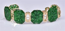 14k Gold Carved Jade Bracelet	
each panel depicting a different animal
7 1/4" long, 20.3 dwt gross