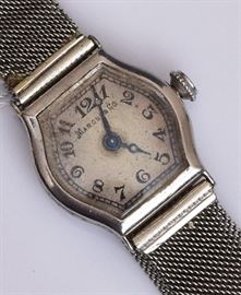 18k Gold Marcus & Co. Ladies Wrist Watch
3/4" face with adjustable band
16.7 dwt gross