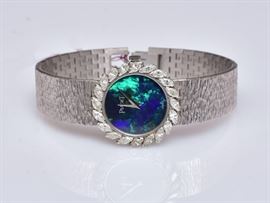Piaget 18k Gold Ladies Wrist Watch
black opal face surrounded by diamonds
3/4" diameter face, 6 1/2" bracelet
30.5 dwt gross    Bid on-line November 10th -15th at www.fairfieldauction.com
