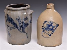Stoneware Crock and Jug	
4 gallon crock, 14 1/4" high
decorated with flowers and leaves
3 gallon jug, 15" high decorated with hearts
19th century    Bid on-line November 10th -15th at www.fairfieldauction.com