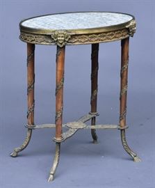 French Guéridon Marble Top and Bronze Side Table
with female masks and hoofed feet
14" x 20", 23 1/2" high
late 19th century   Bid on-line November 10th -15th at www.fairfieldauction.com