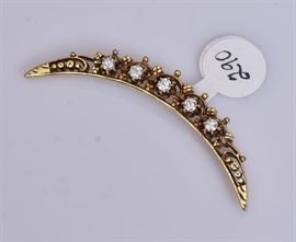 14k Gold Half Crescent Diamond Brooch	
set with five diamonds
2 1/2" long, 6.9 dwt gross   Bid on-line November 10th -15th at www.fairfieldauction.com