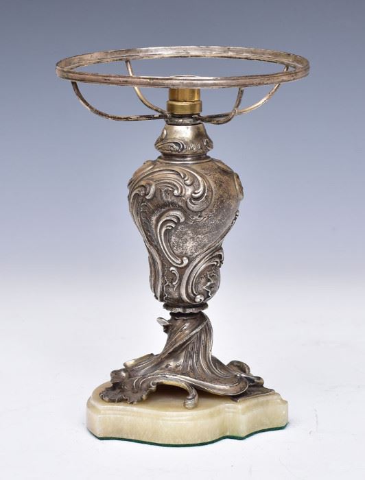 Russian Silver Lamp Base	
with the maker's mark of Faberge
9 1/8" high with 6" fitter
with maker's mark in cyrillic on base    Bid on-line November 10th -15th at www.fairfieldauction.com