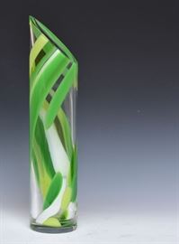Abbey Modell Art Glass Vase
Description	
green swirl design, cylinder shape with
cross cut rim, 21 1/2" tall, signed