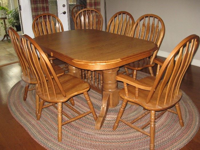 Trestle Oak Dining Room Table with Two Captain Chairs & Six Side Chairs with Two 18" Leaves Stored in Table, One of the Three Matching Braided Rugs...