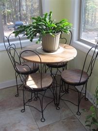 Iron Café Table with Four Chairs/Lots of Plants ...