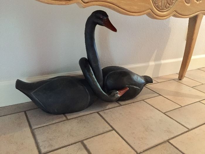 Large carved wood black swans