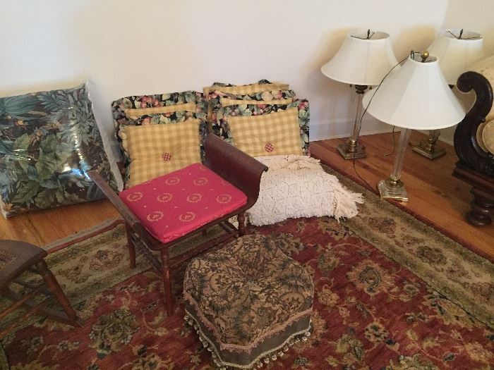 Antique bench, ottoman, bedspreads, pillows, area rug