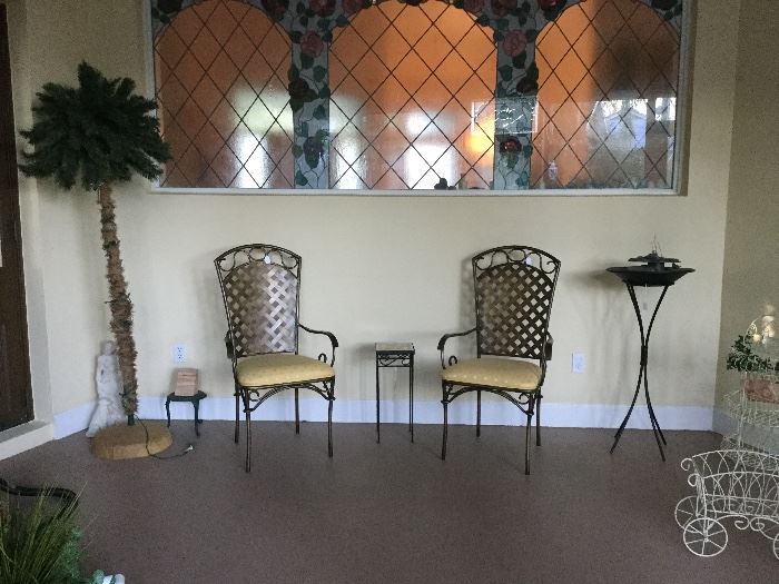 Metal chairs, lighted palm tree