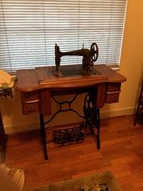 Antique sewing table and machine.  Precision