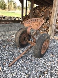 Sulky - original Gravely, two Wheel, cast iron axle, all metal tractor seat , Tires hold air.