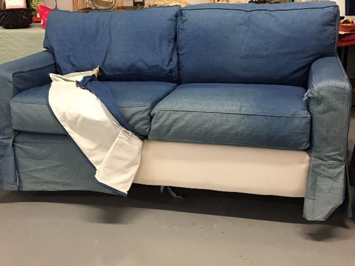 Slip covered sofa bed
