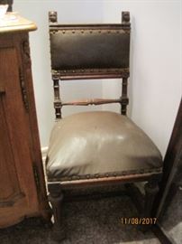 victorian chair with carved male figures