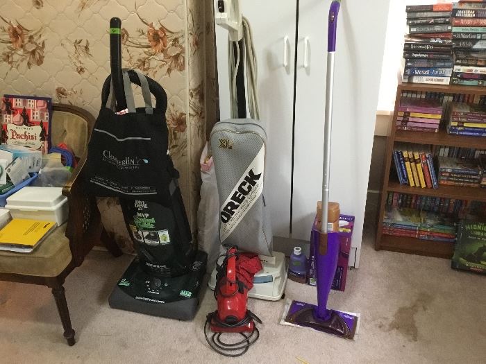 2 different vacuums and a swiffer wet jet