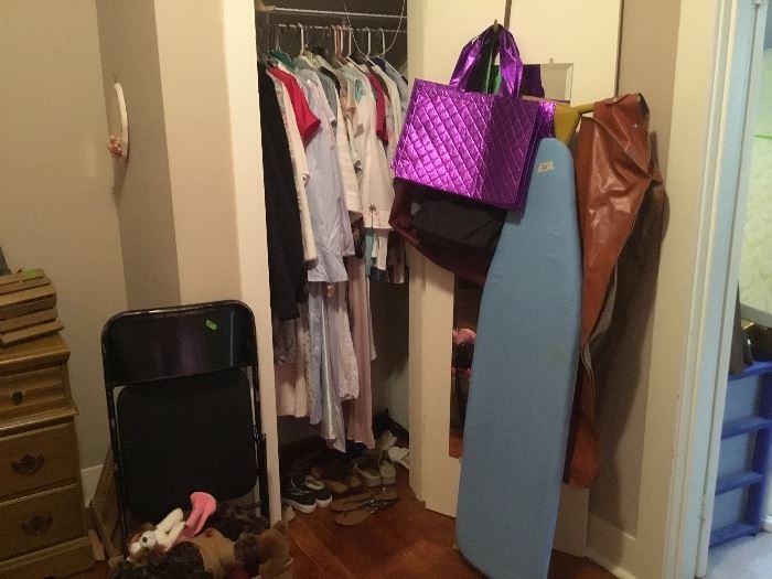 Closet is full. Bags, ironing board and lots more