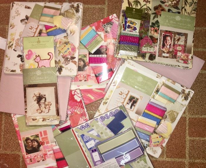 Scrapbook paper and embellishment sets, all in shrink wrap